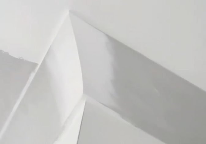 A new run of cornice set into the angle between wall and ceiling, coated and sanded flush.